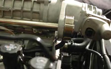 157. Route the stock EVAP tube under the supercharger inlet where the fuel crossover was