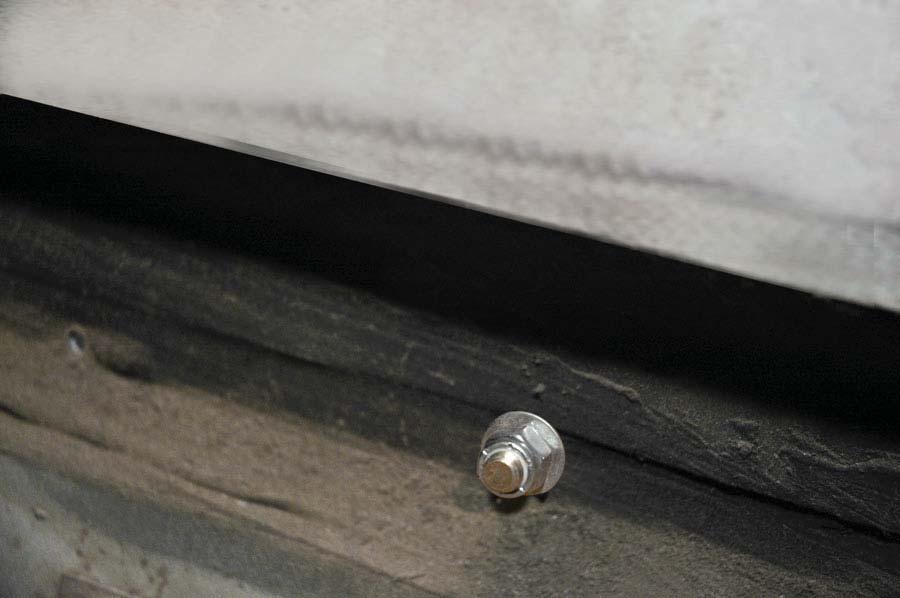 Secure the bolt from inside the vehicle with a 3/8 fl at washer and locknut.