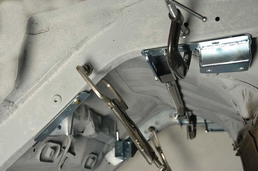10. Use C-clamps on the frame brackets to hold them fi rmly in place. NOTE: Some vehicles can use the axle snubber mounting holes as a reference point.
