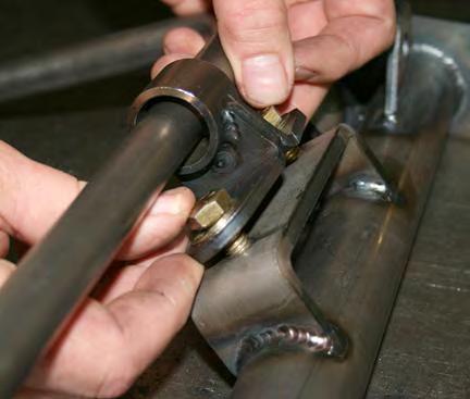 Assemble the sway bar by sliding the tube brackets onto the ends of the bar, then bolt the tube brackets to