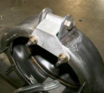 the axle bracket. The torque arm tabs are welded on by using the supplied fixture tool.