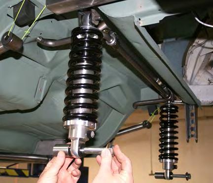 Install the 5/8 by 6 inch bolt with washer on the shock and 1¾ inch spacer on the bolt.