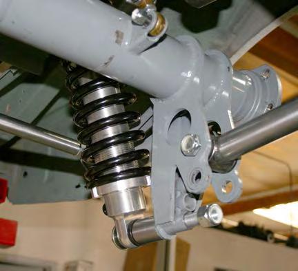 Slide the axle assembly under the car and rest the Torque Arm slider assembly in the driveshaft loop.