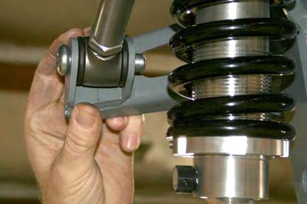 Install the trailing arm bars using the 5/8 by 2¾ inch button head bolts and the half nylocs in