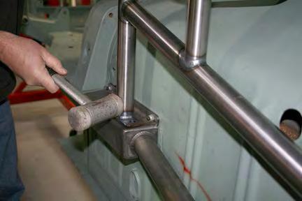 Install one of the bolts and washers through the front of the trailing arm brace brackets (L&R) then