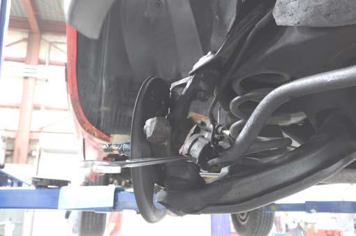 the lower control arm. See Photo 7. 10.