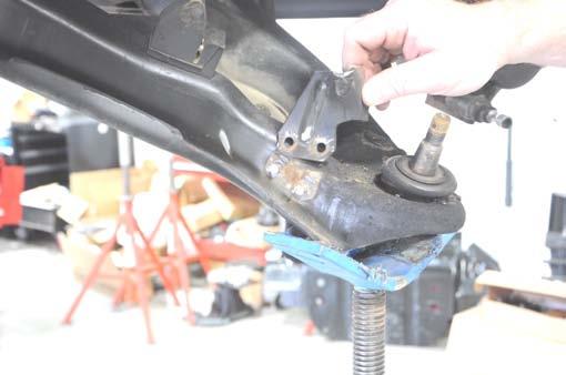 14. Remove the spindle from the lower ball joint.