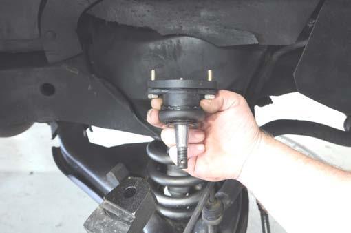 This should allow the ball joint to slip out of the upper control arm.