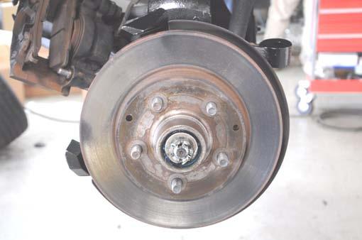 Install the brake caliper using the factory hardware.