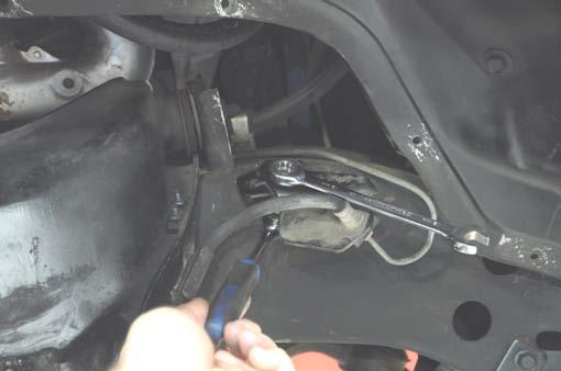 32. Using a flat screwdriver, slightly pry open the brake