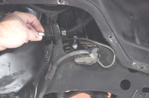 33. Install the supplied brake line bracket to the factory