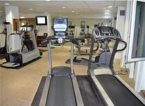 00 a year! The room boasts multi nautilus machines, tread mills, bikes and free weights as well as a TV you can watch.