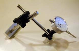 7. Insert the Micrometer Indicator on to the Arm in the location where the bolt and washer were removed. 8. Replace the bolt and washer.