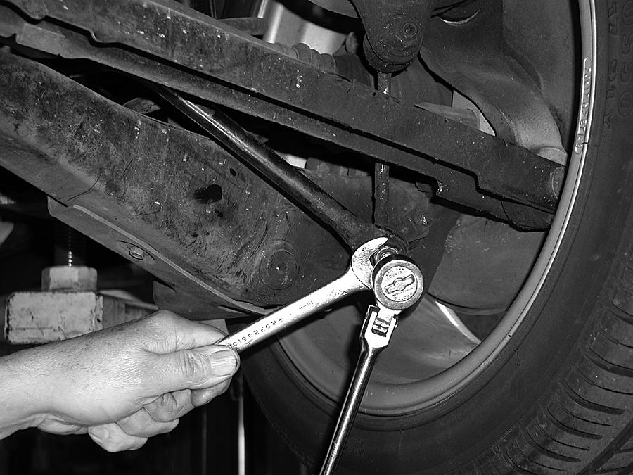 Note: The lower mount on this shock absorber slides over a tubing mount that is part of the lower control arm. Removing this bolt does not release the lower end of the shock absorber.