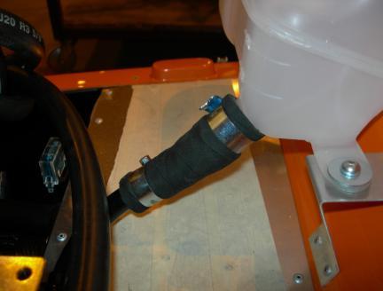Place a washer either side of the cap screw. 28 Position the tank so that it is level. Drill a hole for the other mounting through the scuttle using the tank as a guide.