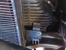 28. Remove plastic strip from the top of the OE intercooler and