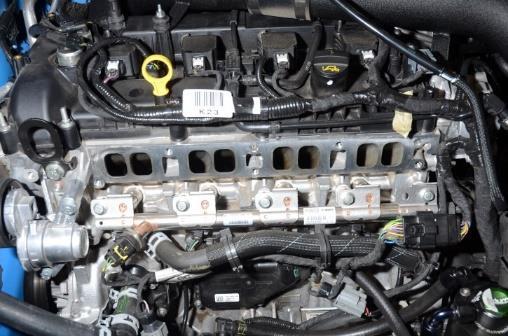 With the intake manifold removed, it is a good time to inspect and clean the cylinder head near the ports.