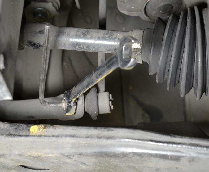 Alternately, use an automotive lift to gain access to the underside of the vehicle. a) Remove the two (2) 14mm nuts holding the front end links to the factory swaybar.
