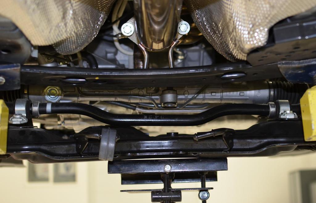 h) Lower the subframe and remove the swaybar from the rear of the subframe. Figure 2g shows the swabar as viewed from the rear of the car. Figure 2g This step can be tricky. Take your time.