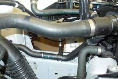 Cut hose of engine outlet / heat exchanger inlet