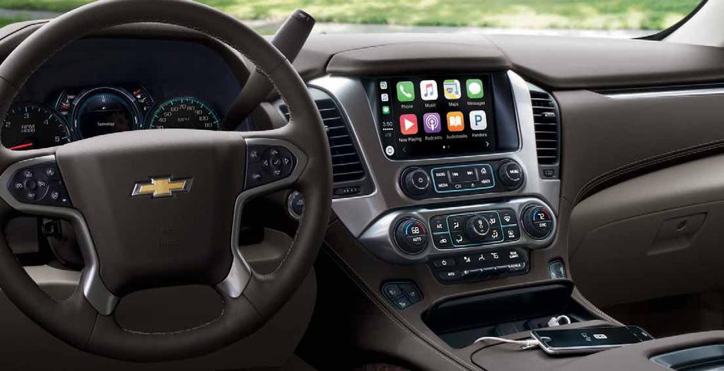 TECHNOLOGY Tahoe Premier interior in Cocoa/Dune with available features. Apple CarPlay COMPATIBILITY. 1 MAINTAIN YOUR CONNECTIONS. SIRIUSXM SATELLITE RADIO. 3 Listen to YOUR PERSONAL PROGRAM DIRECTOR.