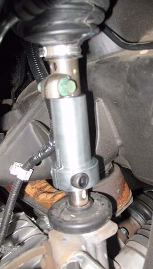 Rotate power steering hose pinch clamp down and away from steering boot. Steering Boot Verify the steering extension is securely installed as specified in the instructions.