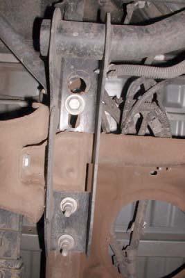 Remove wiring harness from junction on rear crossmember.