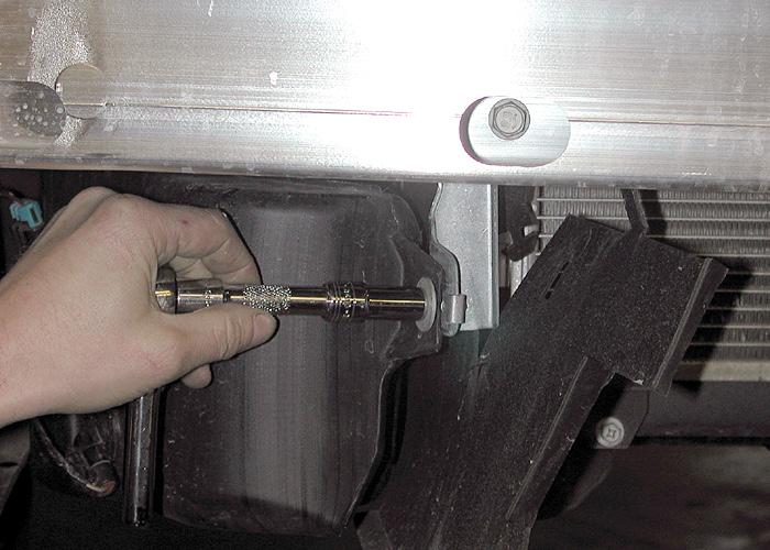 Fit the two lower braces to the subframe Slide the braces between the frame and the
