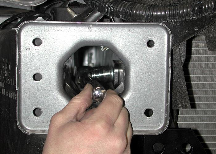 Once the passenger side bolt has been threaded onto the side brace, use an air ratchet to tighten the bolt (Fig.