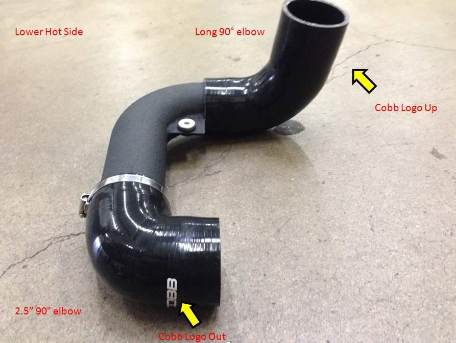 2. Slip the 2.5" 90 end of the pipe over the passenger side core outlet. Place the clamps over each end of the silicone before installation.