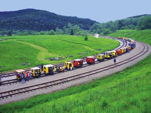 Larger versions would carry half a dozen workers and pull a few trailers loaded with spikes and tools, to handle track maintenance.