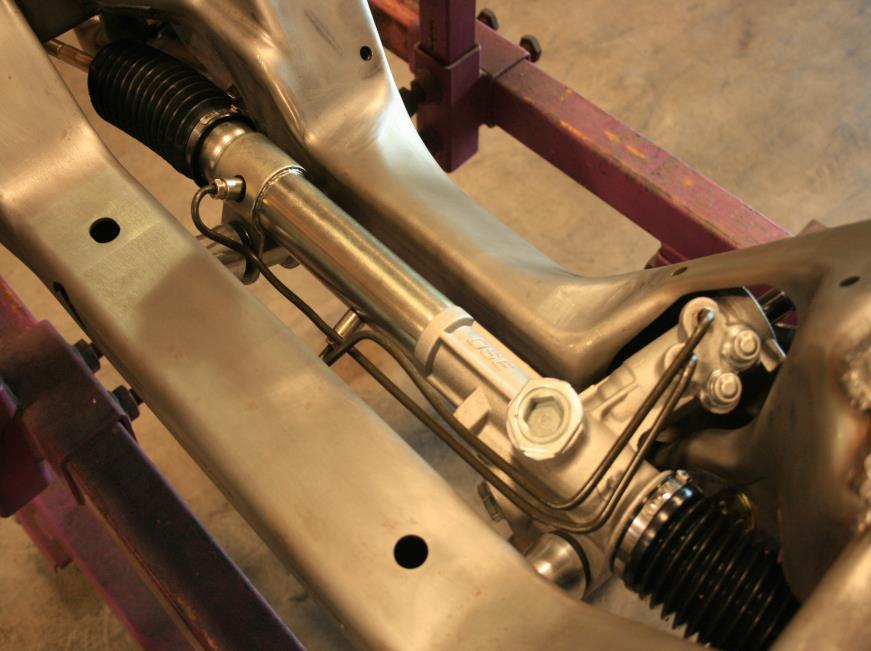 Figure 4 Installed Rack 3. Install the anti-roll bar. a) Lube the outside of the composite bushing with soapy water.