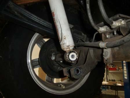 Reattach ABS/brake line brackets and tighten upper and