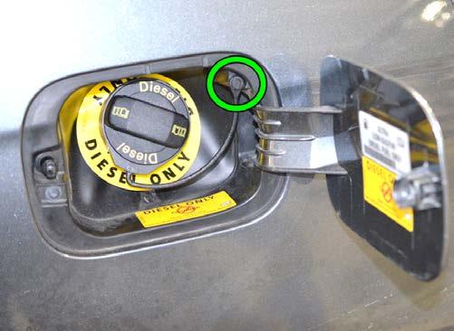 when fully seated against the lockout mechanism. Install the replacement fuel cap.