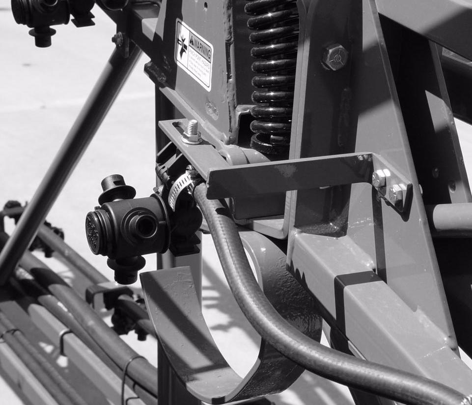 Locate the outer jump nozzle mounting bracket(s) ➀ which is/are wire tied to the support frame(s).