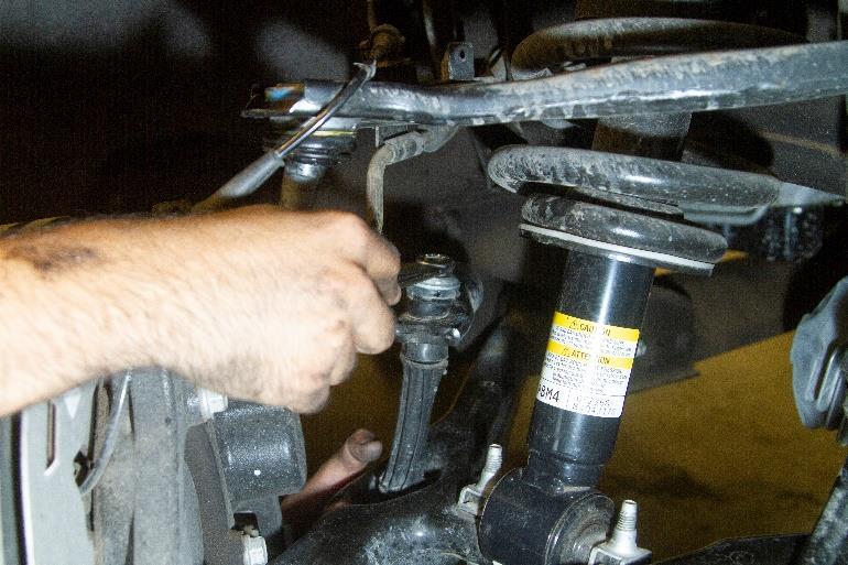 7. Remove the sway bar nut an