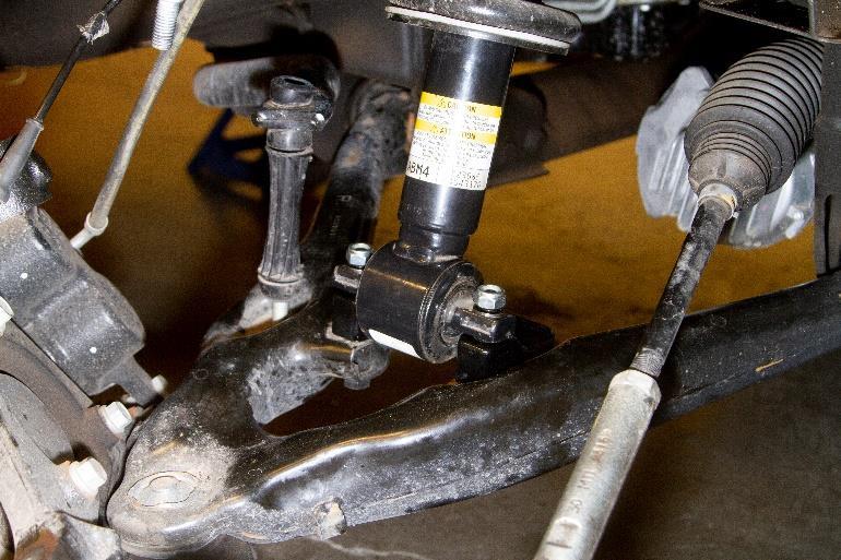 Reinstall the upper ball joint to the knuckle using the factory nut