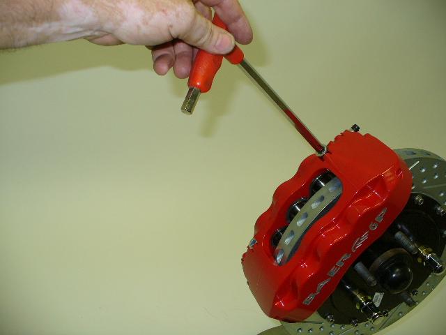 Install the caliper to measure clearance. Measure the gap from the rotor to caliper body at 4 points, top inside and outside, bottom inside and outside. Write down all measurements.