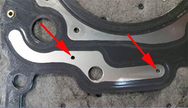 the head gasket for debris in the oil passages noted below. a) If debris is found, inspect the camshaft caps for wear or discoloration due to lack of oil.