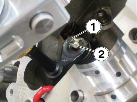 33. When the valve stem is exposed (1), apply a small