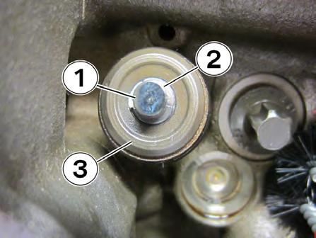 39. Remove the compression lever rod (1) from the compression plates (2) located on the camshaft bearing caps.