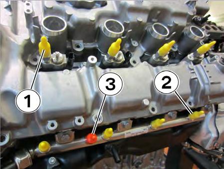 2. Install a yellow cap onto each of the injectors (1) and the high-pressure fuel supply