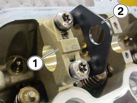13. Exhaust camshaft position: Reinstall the LA5 exhaust camshaft bearing cap (1) with a compression plate (2)
