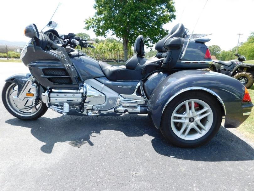 Spoiler with integrated LED Brake lights, Custom Rear Luggage Rack and CB Radio and Antenna. Great Value on a Trike / Bike Combo that listed North of $40,000 new. Price: $23,500.