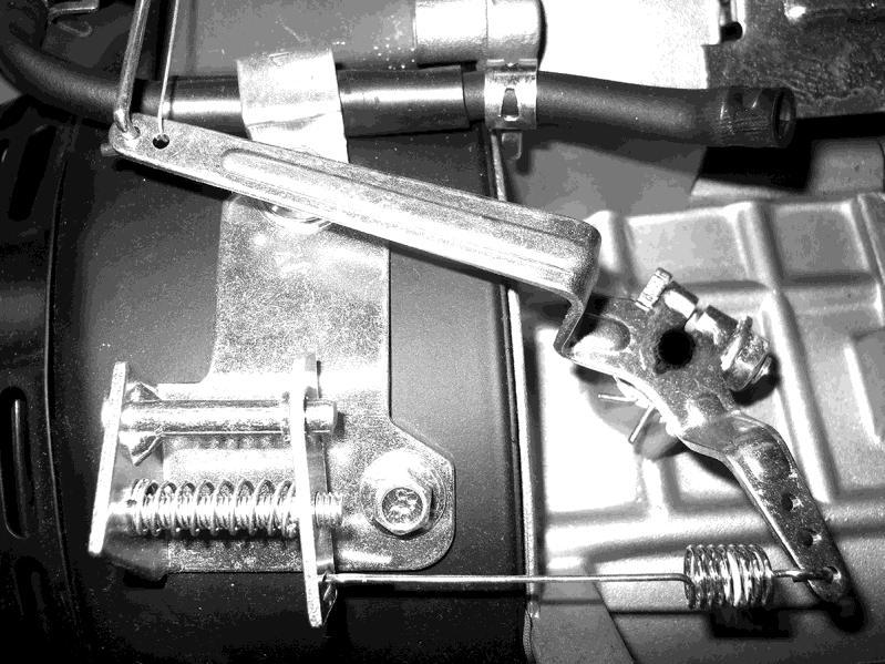Engine Governor Zero Point Setting 2 1. Remove the (3) fuel tank mounting fasteners to gain access to the governor asm. Fuel tank removal is not necessary. 2. Loosen but do not remove the governor pinch nut (A).