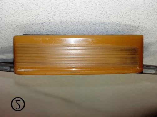 Refer to the above pictures showing an example of normal wear (1) which should not be replaced, and a worn guide (2) which should be replaced.