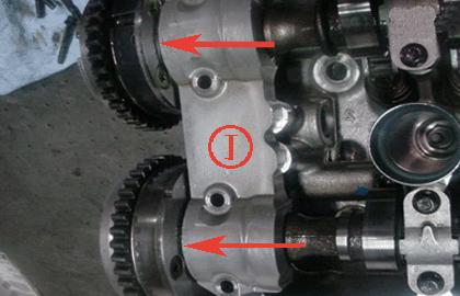 For 1st design shown below, visually inspect for teflon camshaft thrust washers being present between the camshaft