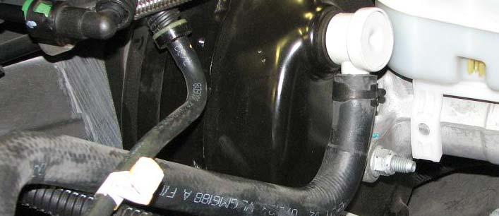 Disconnect the vacuum hose from the brake booster fitting;