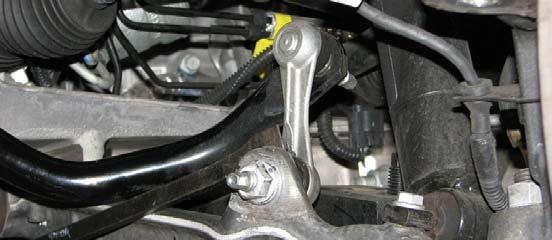 Disconnect the alternator electrical connector. 60. Use GM Ball Joint Separator #J 42188 to separate the steering knuckle from the tie rod ball stud then remove the tool and the nut.
