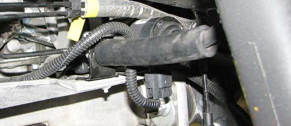Use a 10mm socket to remove the driver side brake line